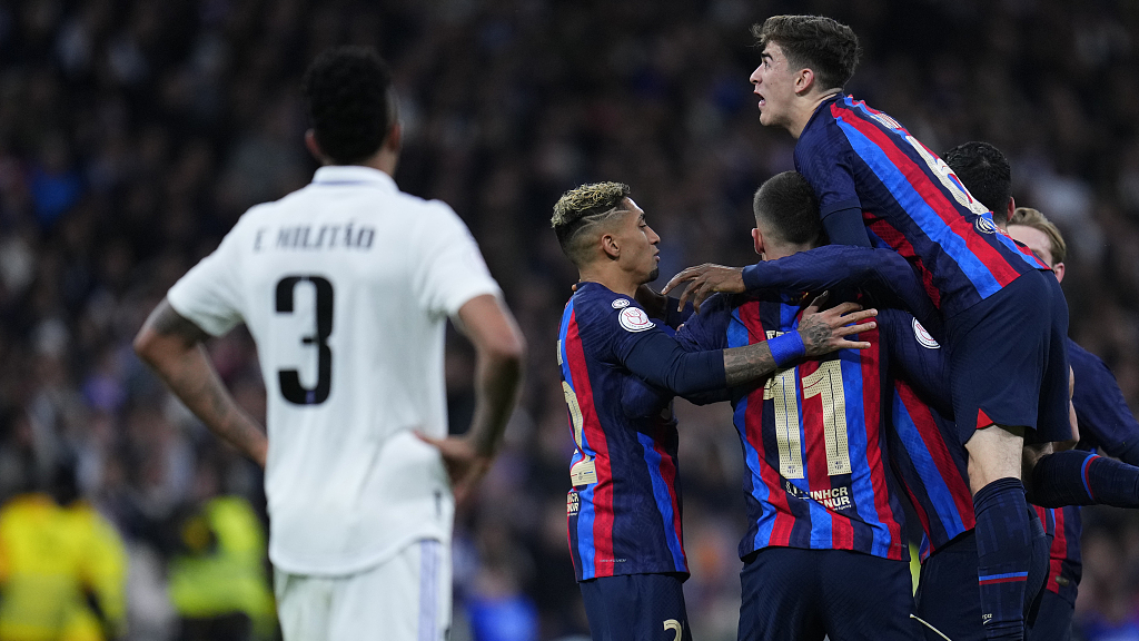 Barcelona players celebrate after Real Madrid's Eder Militao scored an own goal in the first leg of the Copa del Rey semifinal in Madrid, Spain, March 2, 2023. /CFP