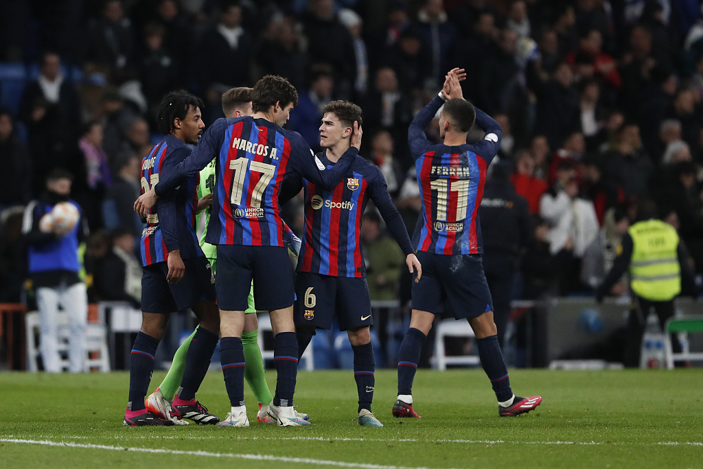 Players of Barcelona celebrate their 1-0 win over Real Madrid in the first-leg game of the Copa del Rey semifinials at the Estadio Santiago Bernabeu in Madrid, Spain, March 2, 2023. /CFP