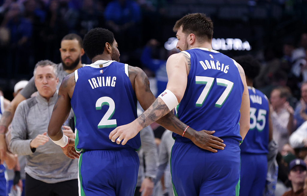 Luka Doncic (#77) and Kyrie Irving (#2) of the Dallas Mavericks celebrate as they go back to the bench in the game against the Philadelphia 76ers at the American Airlines Center in Dallas, Texas, March 2, 2023. /CFP