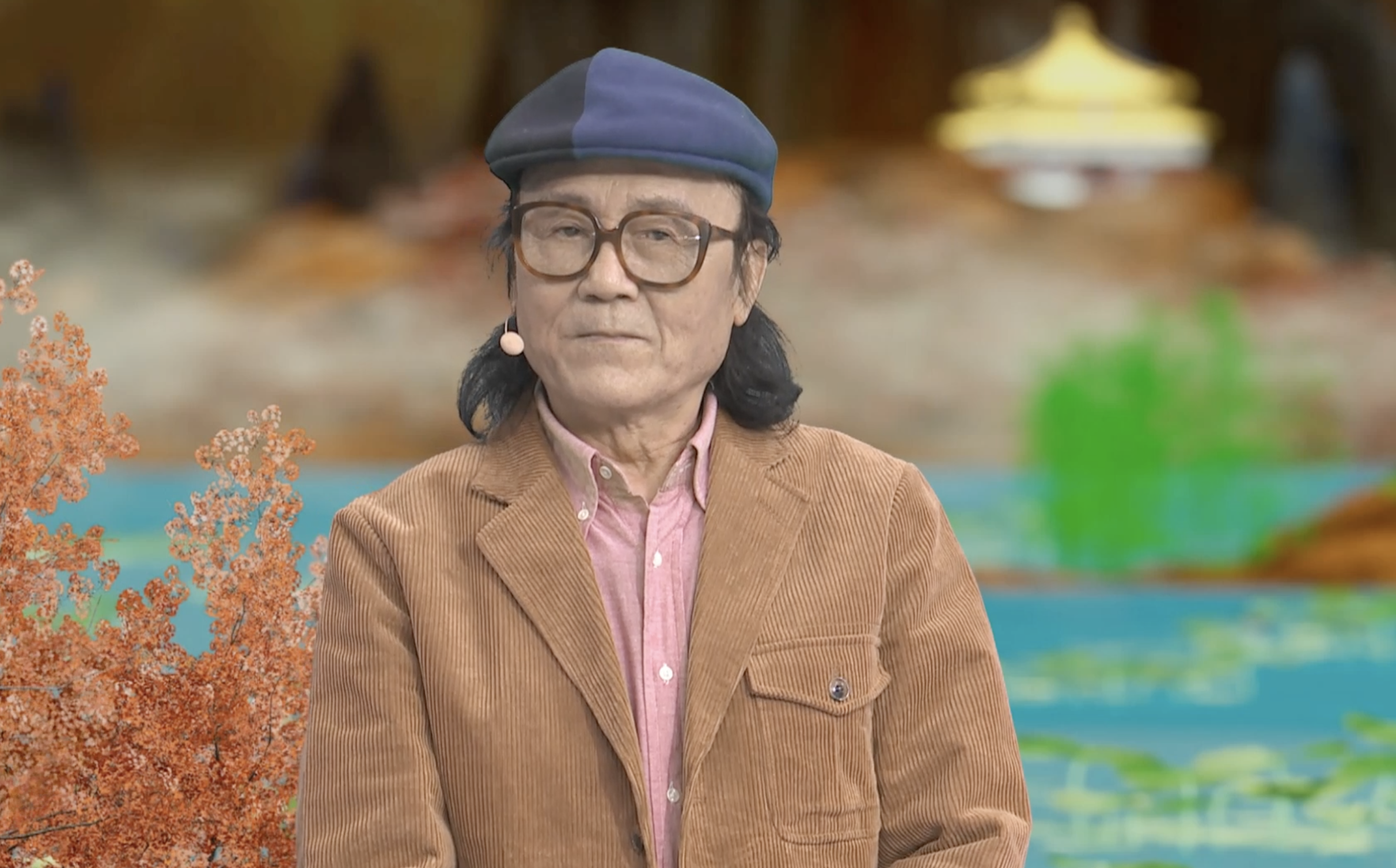 Chinese painter Shi Qi tells his story on a TV show. /CGTN
