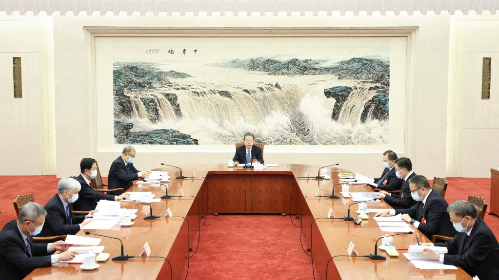Zhao Leji, executive chairman of the presidium of the first session of the 14th National People's Congress (NPC), presides over the second meeting of executive chairpersons of the presidium at the Great Hall of the People in Beijing, China, March 8, 2023. /Xinhua