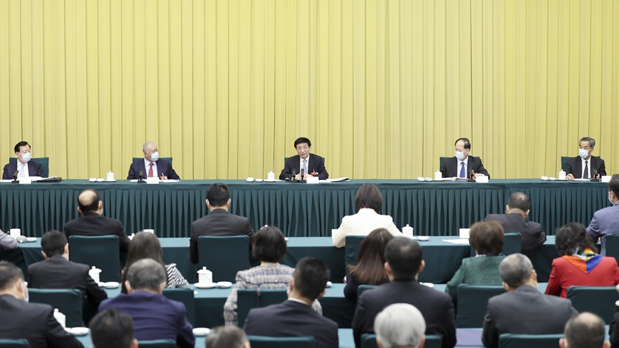 Wang Huning, a member of the Standing Committee of the Political Bureau of the Communist Party of China Central Committee, joins discussions with political advisors from Hong Kong and Macao during the first session of the 14th National Committee of the Chinese People's Political Consultative Conference in Beijing, March 8, 2023. /Xinhua