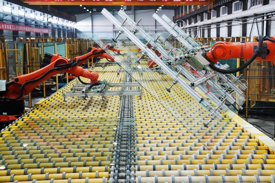 Robot arms working on a production line at a glass factory in Jiamusi, northeast China's Heilongjiang Province, February 17, 2023. /Xinhua