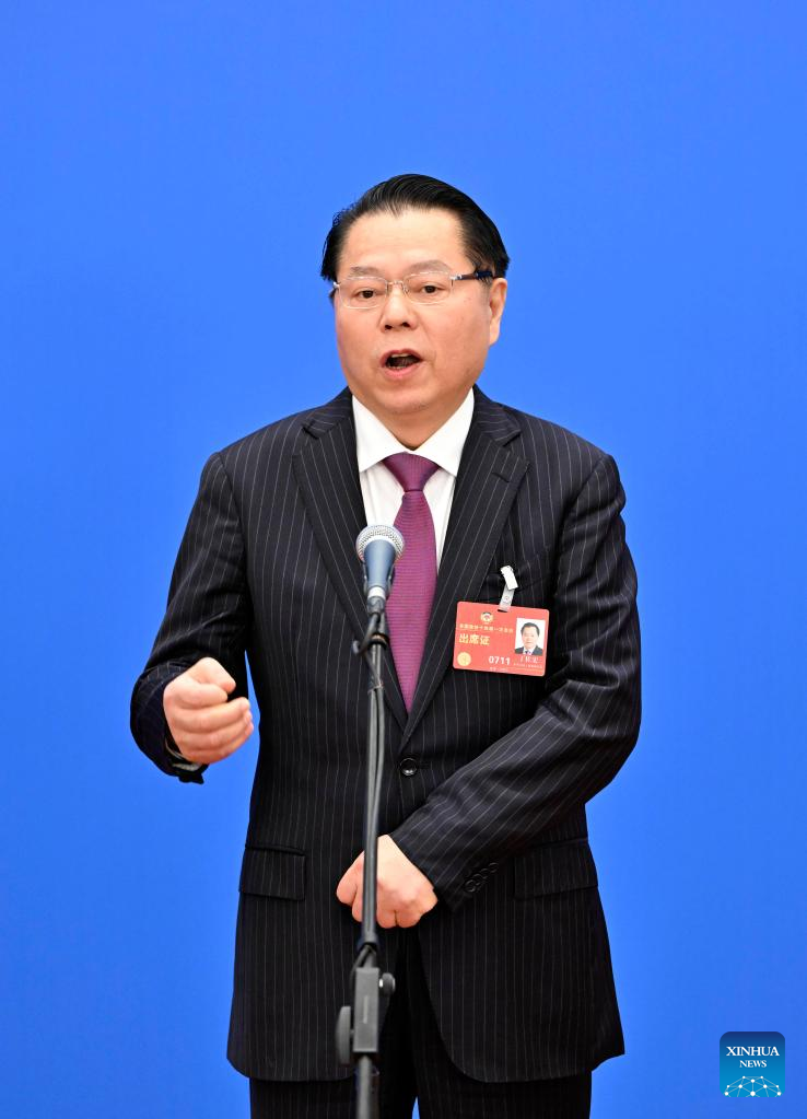 Ding Zuohong, a member of the 14th National Committee of the Chinese People's Political Consultative Conference and chairman of Yuexing Group, at the Members' Corridor at the Great Hall of the People in Beijing, March 11, 2023. /Xinhua
