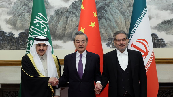 Wang Yi (M), Musaad bin Mohammed Al-Aiban (L) and Ali Shamkhani pose for photo in Beijing, capital of China, March 10, 2023. /Chinese Foreign Ministry