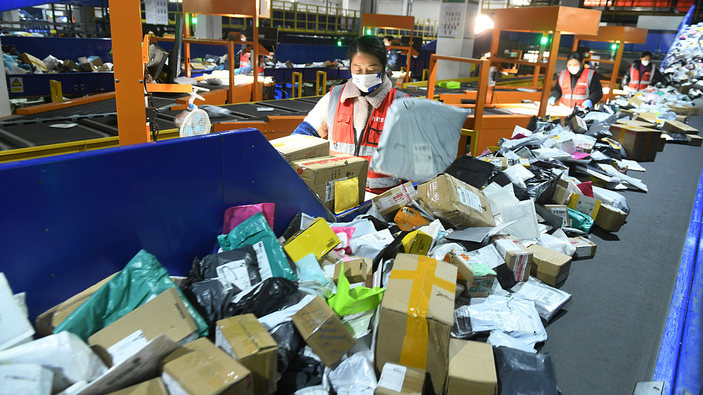Staff sorting packages in a facility in Fuyang City, Anhui Province, China, February 1, 2023. /CFP