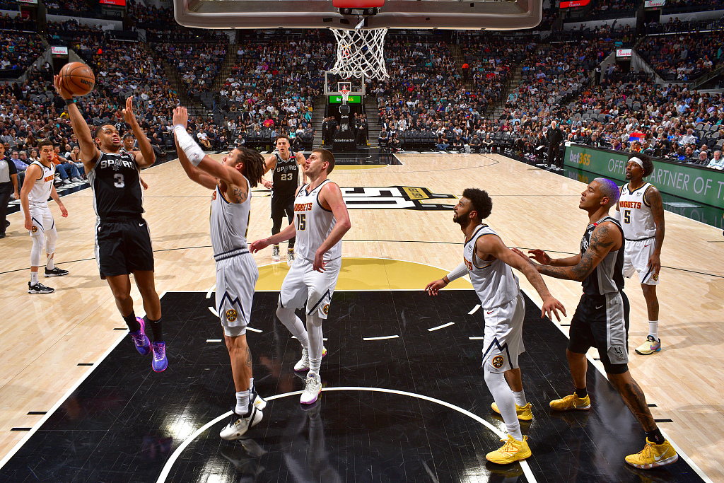 Keldon Johnson (#3) of the San Antonio Spurs shoots in the game against the Denver Nuggets at the AT&T Center in San Antonio, Texas, March 10, 2023. /CFP