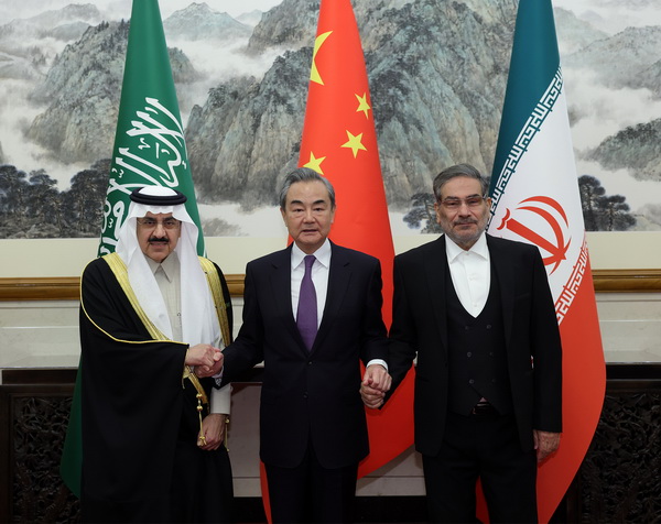 Wang Yi (M), Musaad bin Mohammed Al-Aiban (L) and Ali Shamkhani pose for photo in Beijing, China, March 10, 2023. /Chinese Foreign Ministry