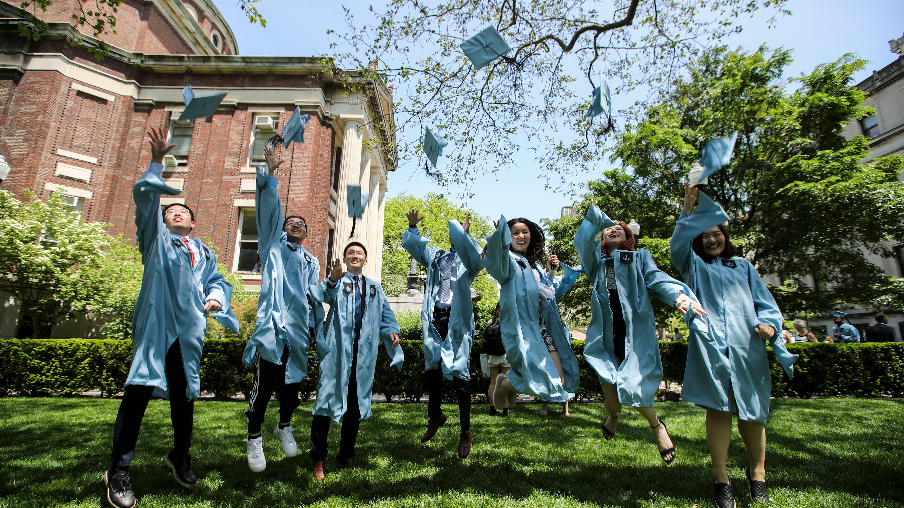 Graduate students from China pose for photos on campus after the Columbia University Commencement ceremony in New York, the U.S., May 22, 2019. /Xinhua
