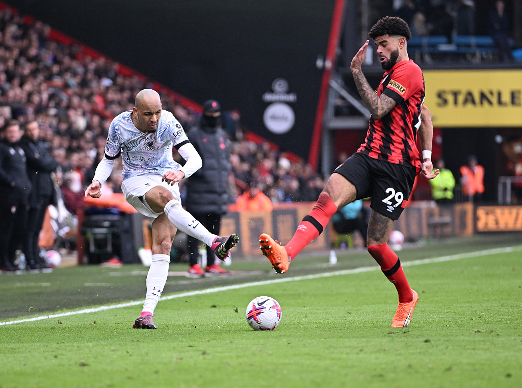 Philip Billing (R) of Bournemouth and Fabinho of Liverpool battle for the ball during their Premier League match at Vitality Stadium in Bournemouth, England, March 11, 2023. /CFP