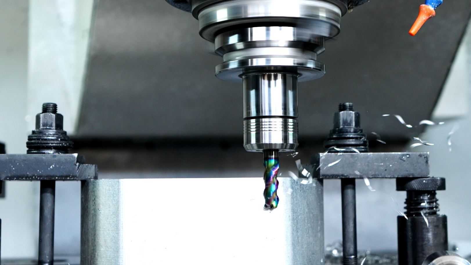 A machine drives a cutter to cut a work piece. /CGTN