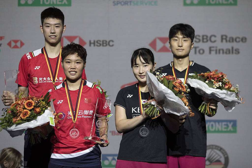 (From left to right) Gold medalist Feng Yanzhe, Huang Dongping of China,  silver medlaist Jeong Na-eun, and Kim Won-ho of South Korea at the award ceremony of the mixed doubles at the Badminton German Open in Muelheim, Germany, March 12, 2023. /CFP