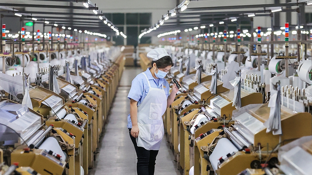 A worker at a textile factory in China's Fujian Province, March 9, 2022. /CFP