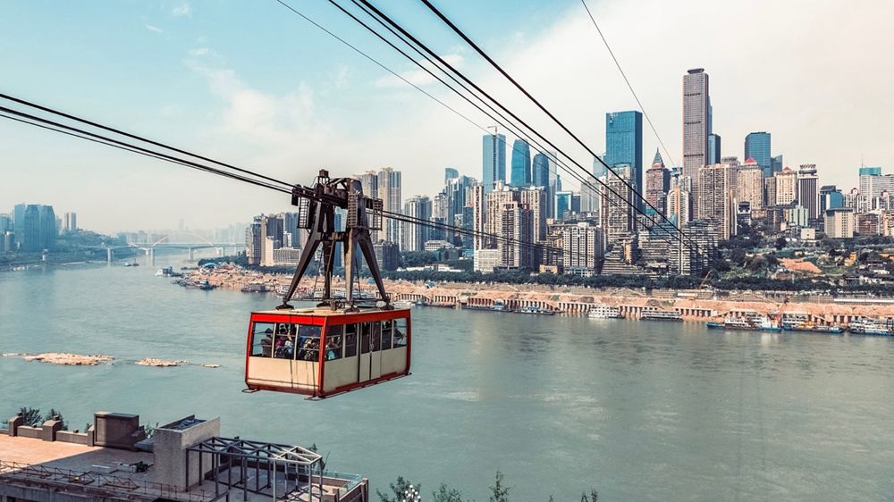 Riding a cable car is a unique way to see the gorgeous scenery on both sides of the Yangtze River in Chongqing. /CFP