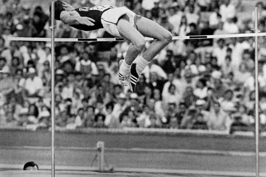 American athlete Dick Fosbury competes in the men's high jump final on his way to winning the gold medal with a brand-new style of jumping during the Olympic Games in Mexico, October 20, 1968. /AFP