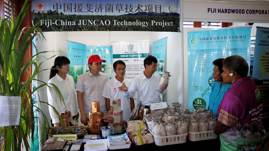 Chinese technicians demonstrate a product to Fijian people in Nadi, Fiji, March 10, 2023. /Xinhua