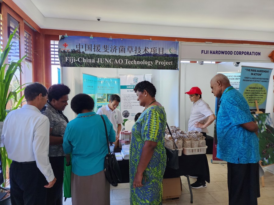Chinese technicians demonstrate a product to Fijian people in Nadi, Fiji, March 10, 2023. /Xinhua