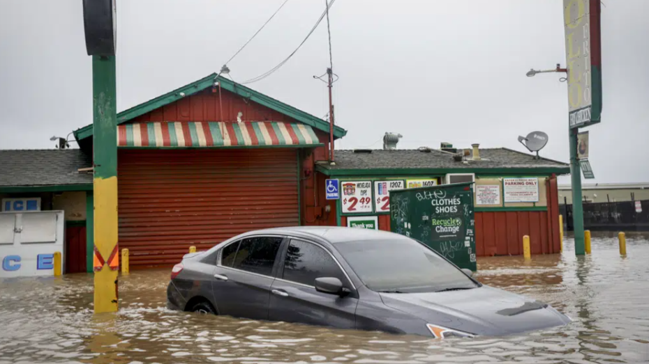 Floodwater from a breached levee submerges cars and floods businesses on Salinas Road in Pajaro, California, March 14, 2023. /AP