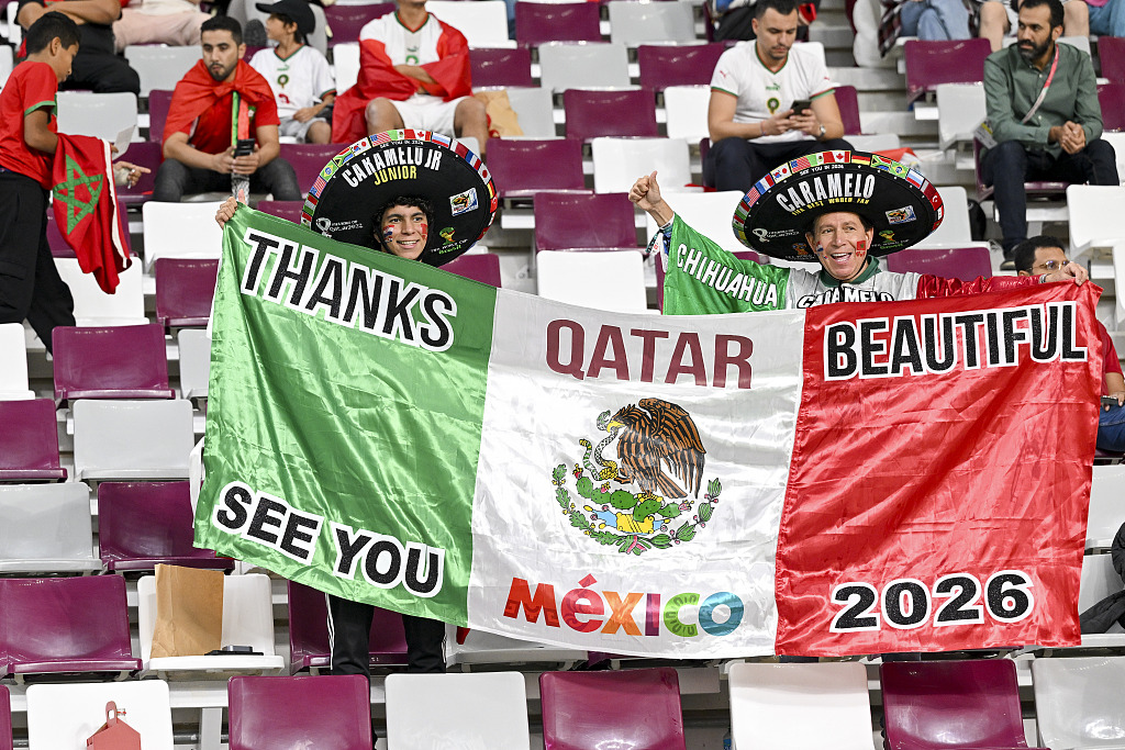 Fans with banners saying 
