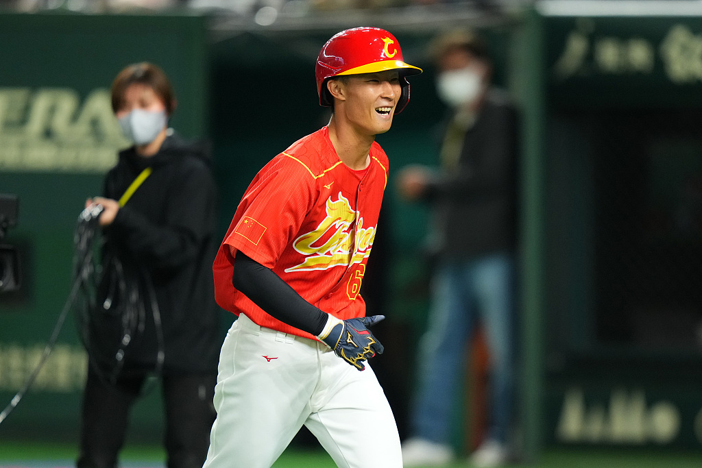 Liang Pei of China celebrates after hitting a home run during the sixth inning in the game against Japan at the World Baseball Classic at Tokyo Dome in Tokyo, Japan, March 9, 2023. /CFP