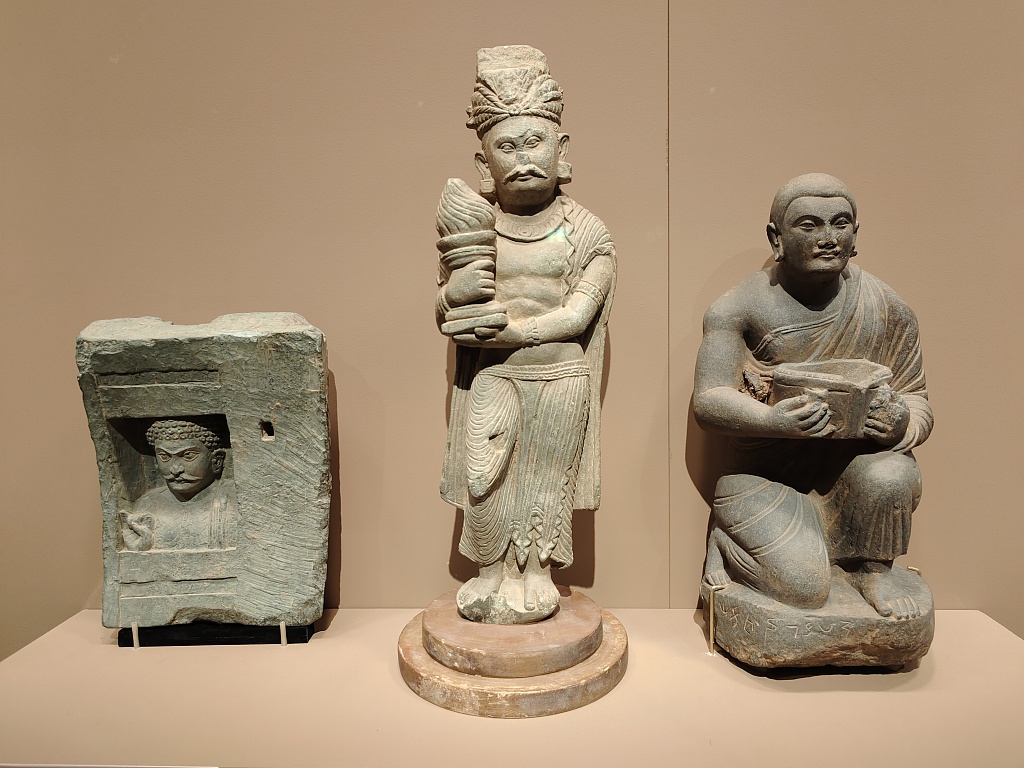 Artifacts from the 'Gandhara Heritage Along the Silk Road' exhibition are displayed at the Palace Museum, Beijing. /CFP