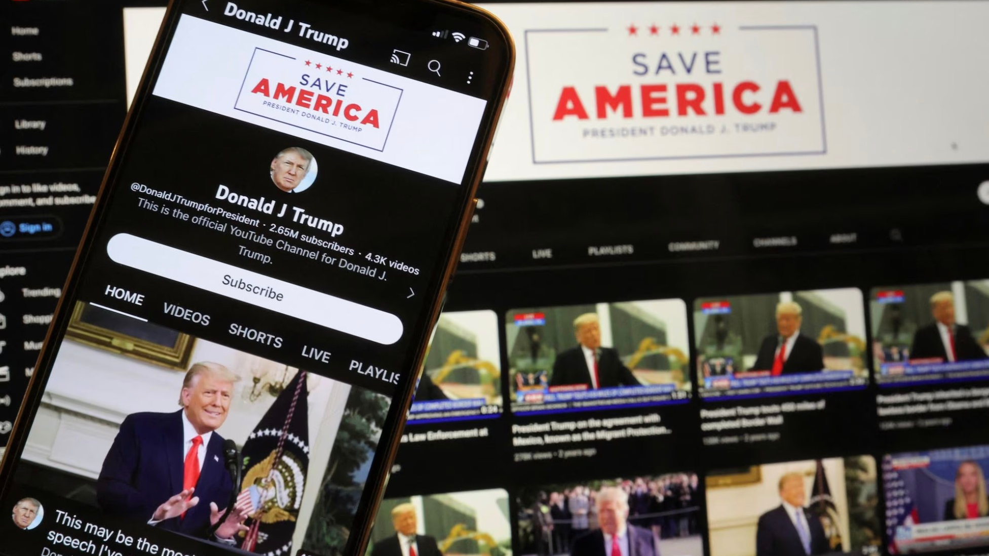 Former U.S. President Donald Trump's YouTube account is seen on a mobile phone and laptop computer after being restored by Google and its parent company Alphabet Inc, as Google lifted a more than two-year suspension imposed on Trump after the deadly January 6, 2021, Capitol Hill riot, in Washington, U.S., March 17, 2023. /Reuters