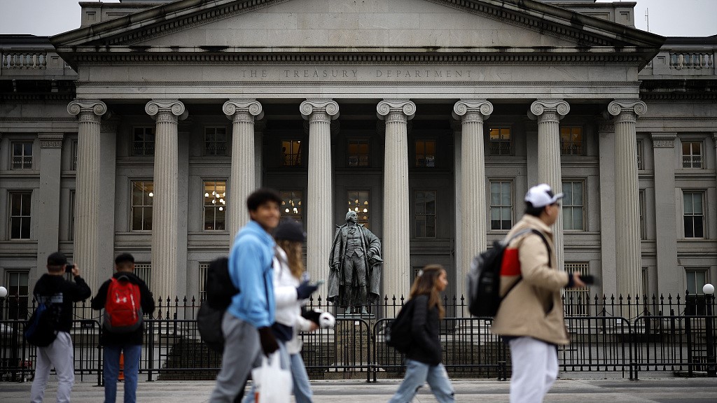 People walk past the U.S. Department of Treasury building, March 13, 2023. /CFP