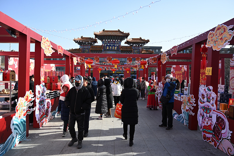 Visitors stroll along Saishang Old Street in Hohhot City, north China's Inner Mongolia Autonomous Region. /CFP