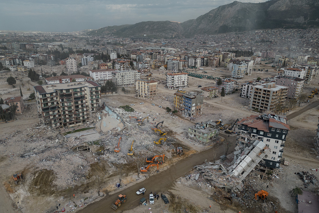 Search and rescue teams remove the debris of demolished buildings in Hatay, Türkiye, March 13, 2023. /CFP