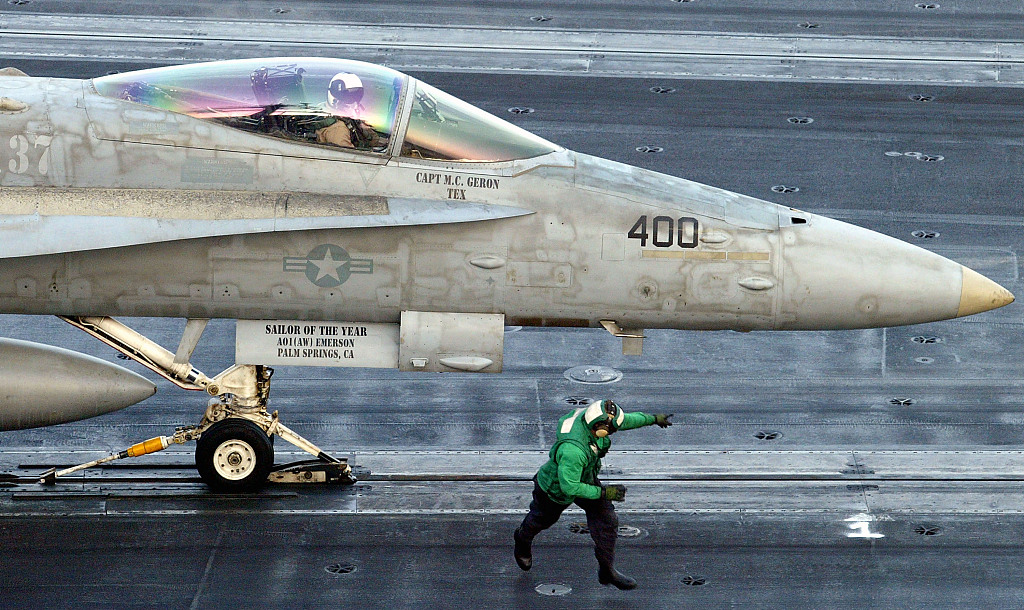 A U.S. Navy F/A-18 Hornet prepares to launch from the flight deck of the USS Constellation shortly after U.S. President George Bush declared that war against Iraq had begun in the Persian Gulf, March 20, 2003. /CFP