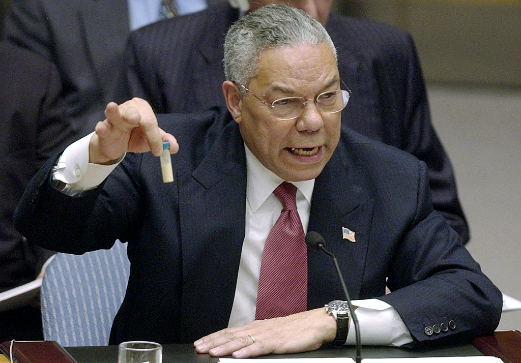 U.S. Secretary of State Colin Powell holds up a vial he said could contain anthrax as he presents evidence of Iraq's alleged weapons programs to the United Nations Security Council, February 5, 2003. /CFP