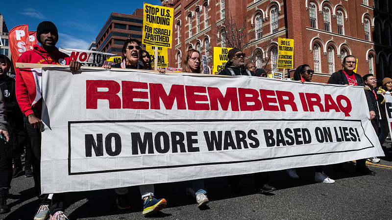 Anti-war protesters march through Washington, D.C. March 18, 2023. /CFP