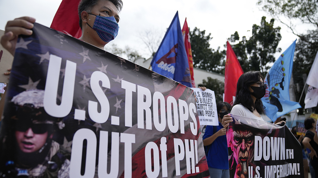 Demonstrators hold banners as they protest against the visit of U.S. Defense Secretary Lloyd Austin outside Camp Aguinaldo military headquarters in Manila, Philippines, February 2, 2023. /CFP