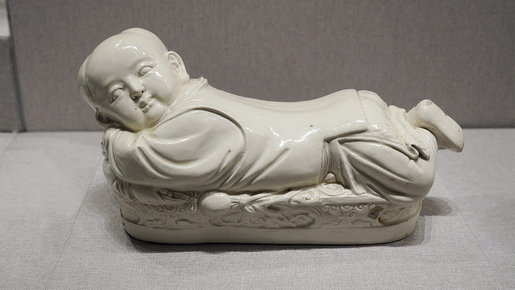 A white porcelain pillow in the shape of an infant from the Northern Song Dynasty. /CFP