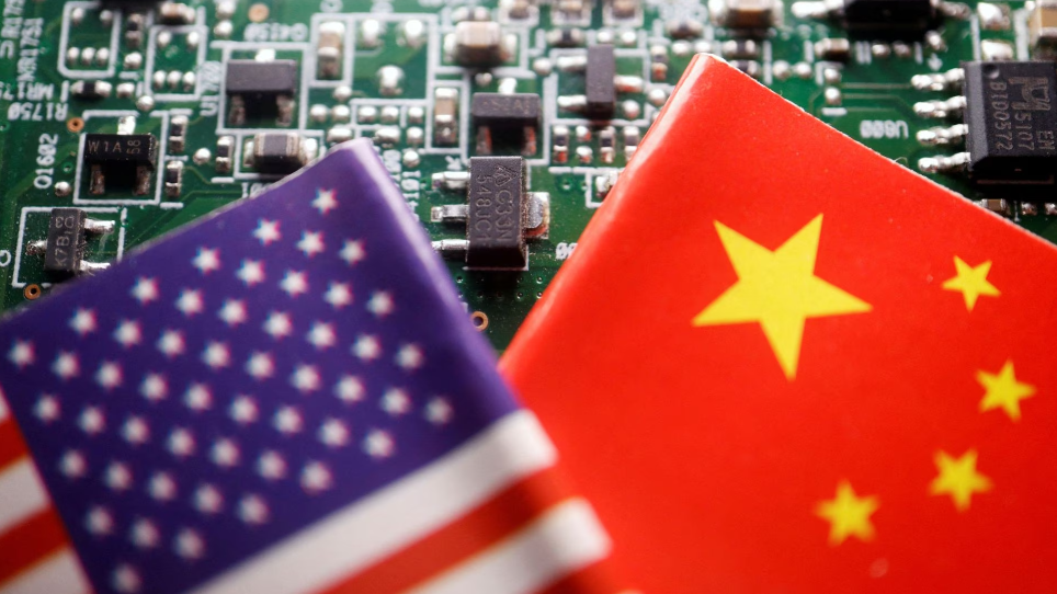 Flags of China and U.S. are displayed on a printed circuit board with semiconductor chips in the illustration picture, February 17, 2023. /Reuters