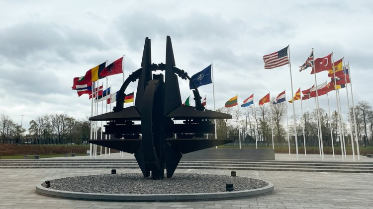 A sculpture and flags at NATO headquarters in Brussels, Belgium, April 6, 2022. /Xinhua