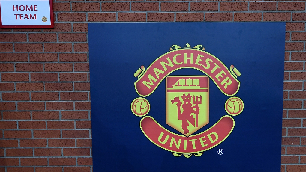 A sign with the logo of Manchester United is seen outside the stadium prior to their home game at Old Trafford in Manchester, England, October 23, 2022. /CFP
