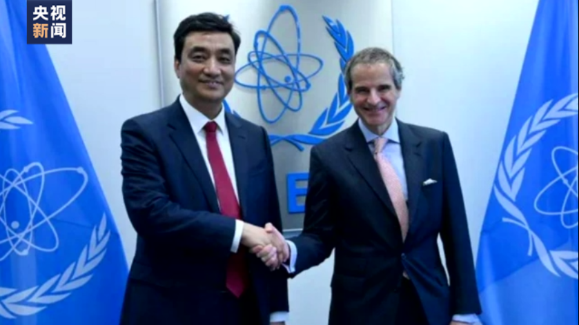 Dong Baotong (L), vice minister of the Ministry of Ecology and Environment shakes hands with IAEA Director General Rafael Mariano Grossi, March 23, 2023. /China Media Group