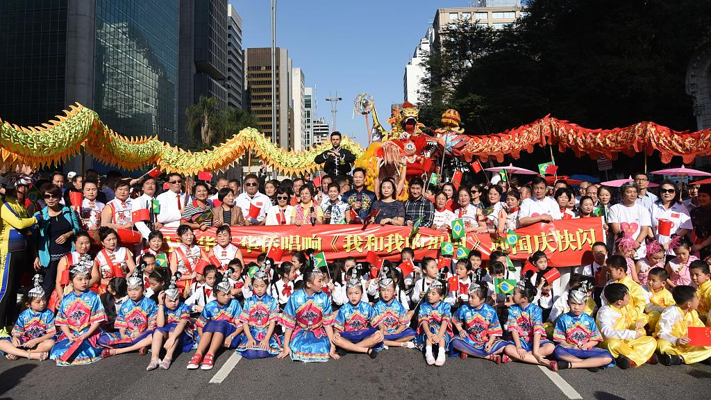 Chinese people hold a flash mob to celebrate the 70th anniversary of the founding of the People's Republic of China and National Chinese Immigration Day in São Paulo, Brazil on August 11, 2019. /CFP