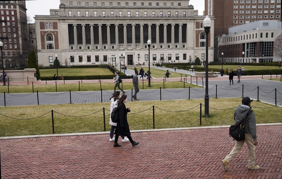 People walk on the campus of Columbia University in New York, the United States, March 10, 2020. /Xinhua