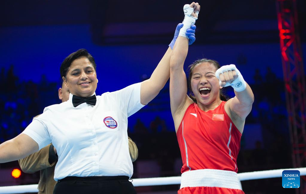 Wu Yu (R) of China celebrates after she is declared the winner of the competition against Sirine Charaabi of Italy during the elite women's 50-52kg flyweight final at the IBA World Women's Boxing Championships 2023 in New Delhi, India, March 25, 2023. /Xinhua