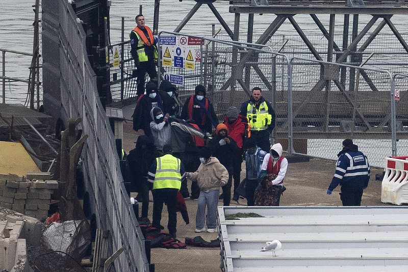 Migrants including women and children are removed from a Border Force vessel after being picked up in the Channel in Dover, England, March 6, 2023. /CFP