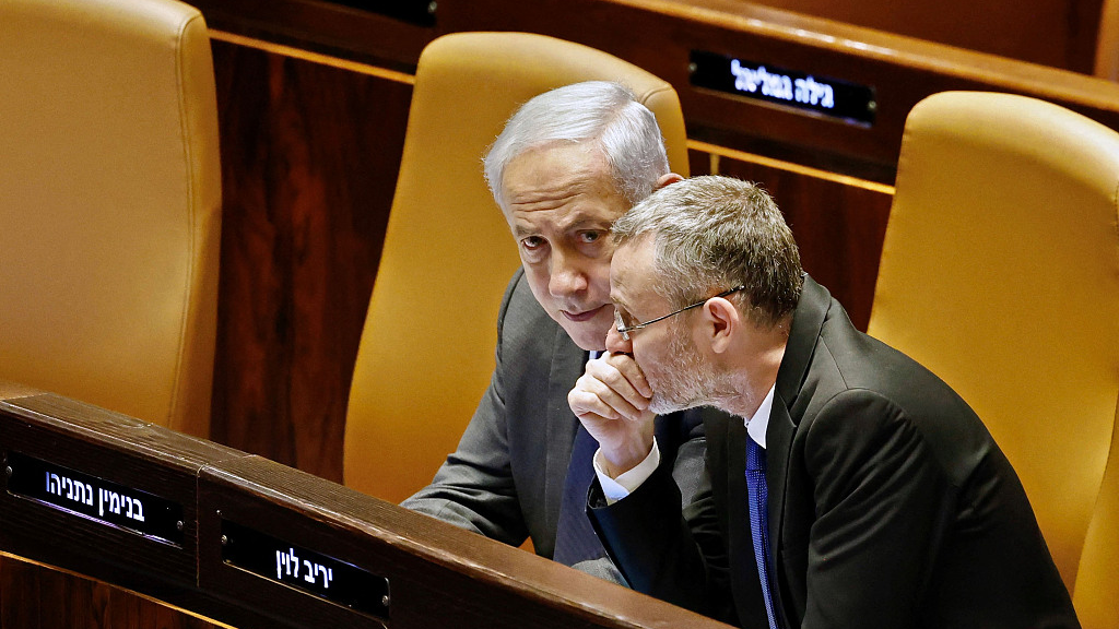 Israeli Prime Minister Benjamin Netanyahu (L) sits at the Knesset, Israel's parliament in Jerusalem, March 27, 2023. /CFP