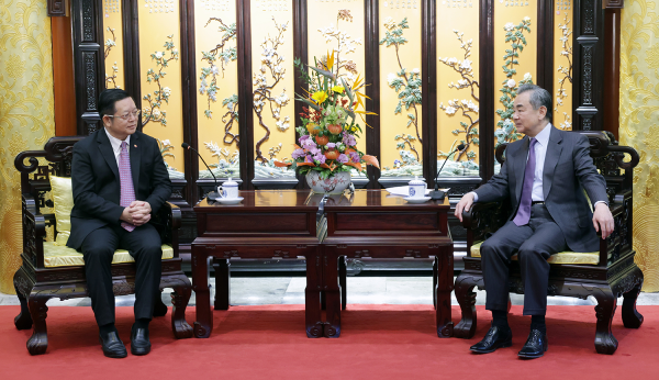 Wang Yi (R), a member of the Political Bureau of the Communist Party of China (CPC) Central Committee and director of the Office of the Foreign Affairs Commission of the CPC Central Committee, meets with Kao Kim Hourn, secretary-general of the Association of Southeast Asian Nations, in Beijing, China, March 27, 2023. /Xinhua