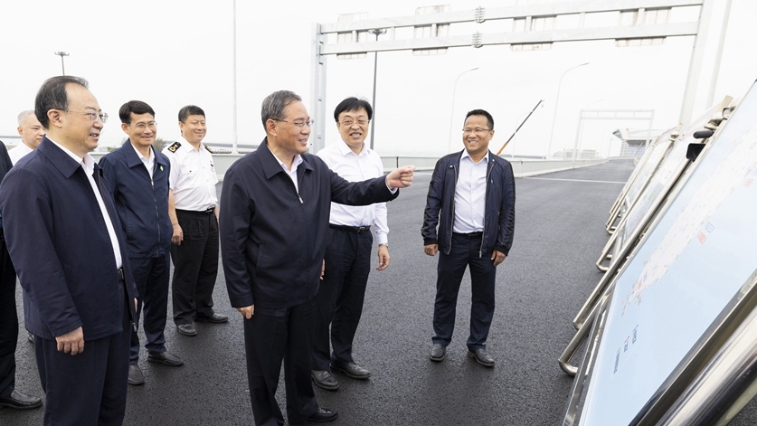 Chinese Premier Li Qiang inspects the construction site of the passenger transportation station at Xinhai Port in Haikou, south China's Hainan, March 29, 2023. /Xinhua