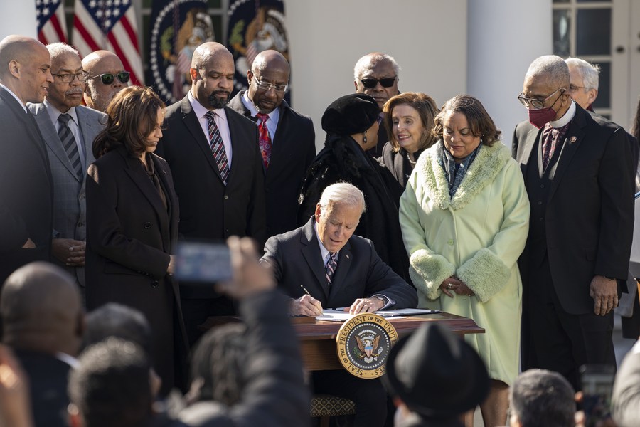 U.S. President Joe Biden signs the Emmett Till Anti-Lynching Act in the Rose Garden of the White House in Washington, D.C., the United States, March 29, 2022. /Xinhua