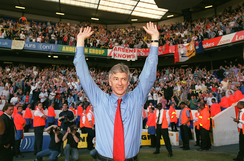 Arsene Wenger celebrates Arsenal winning the Premier League after their match against Tottenham at White Hart Lane in London, England, April 25, 2004. /CFP