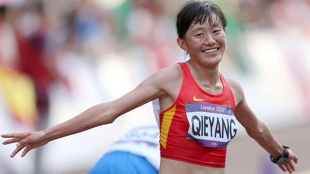 Qieyang Shijie reacts after finishing the women's 20km race walk at the Olympics in London, England, August 11, 2012. /CFP