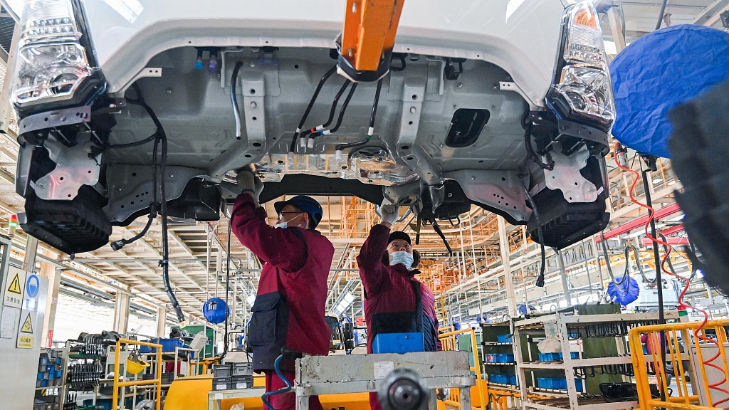 Workers operate at a car plant in east China's Shandong Province, January 28, 2023. /CFP