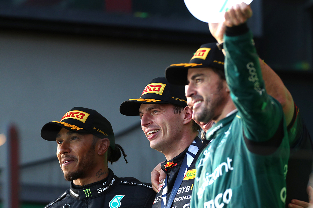 L-R: Second placed Lewis Hamilton of Mercedes, race winner Max Verstappen of Red Bull Racing, and third placed Fernando Alonso of Aston Martin celebrate on the podium after the race in Melbourne, Australia, April 2, 2023. /CFP